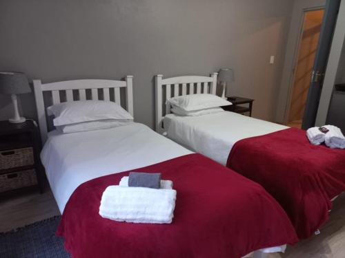 two beds sitting next to each other with towels on them at Eagle's Crest in Worcester