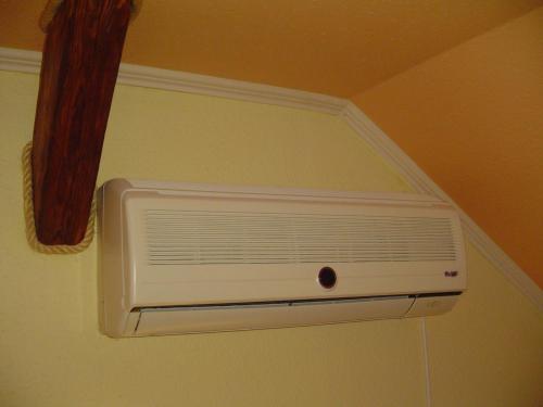 a ceiling with a air conditioner in a room at Hunter in Štúrovo