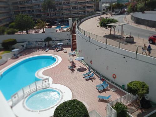 a swimming pool on the side of a building at Europa 505 in Maspalomas