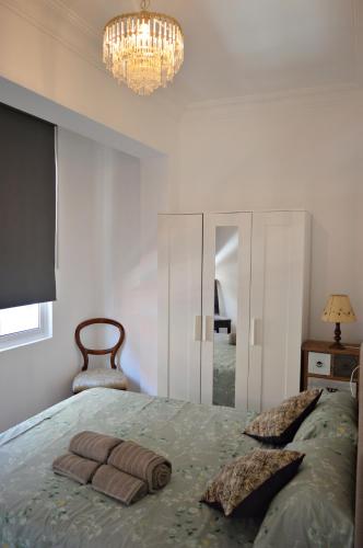 a bedroom with a bed with two pillows on it at Apartamento en centro de Ferrol in Ferrol