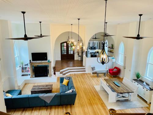 a living room with a blue couch and a fireplace at The Sanctuary:Downtown Staunton in Staunton
