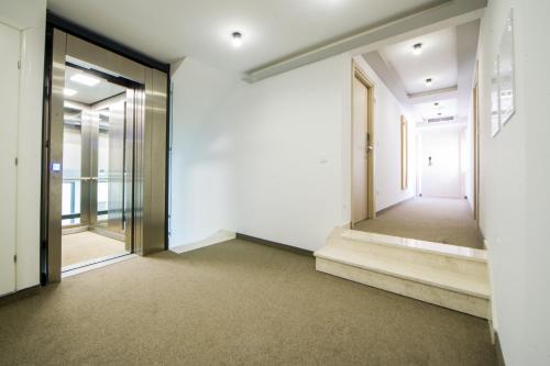 an empty room with doors and a hallway at Hotel Soldo in Međugorje