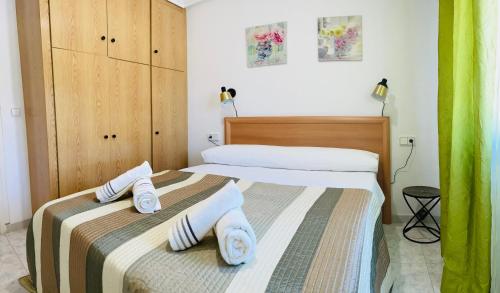 Posteľ alebo postele v izbe v ubytovaní Apartamento Calipso Plus