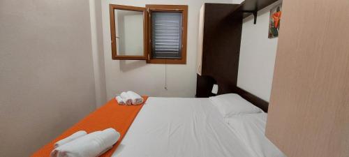Postel nebo postele na pokoji v ubytování Liberato Puglia Vacanze