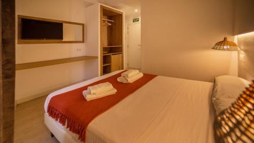 Postel nebo postele na pokoji v ubytování Xubec - Albergue Juvenil