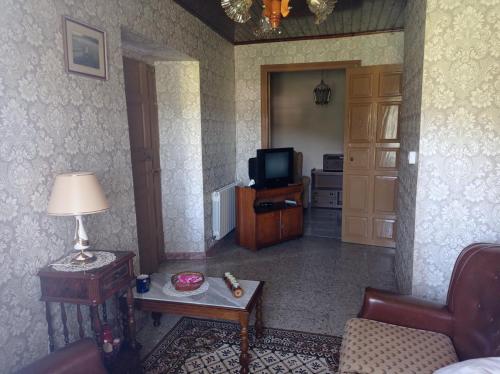 Televízia a/alebo spoločenská miestnosť v ubytovaní CASA DO RIZAL