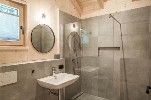 a bathroom with a sink and a shower at Thörl 149 - skandinavisches Design mit Bergblick in Bad Mitterndorf