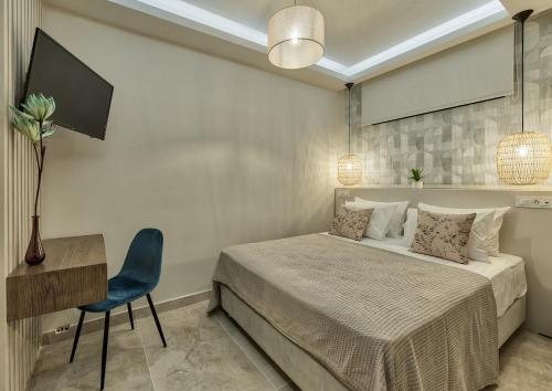 a bedroom with a bed and a desk and a chair at Delight Luxury Villa - Contemporary Elegance & Tranquility, by ZanteWize in Zakynthos Town