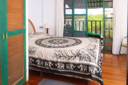 Llit o llits en una habitació de Galapagos Chalet