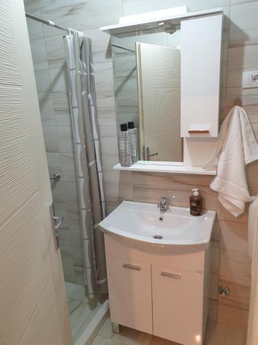 a bathroom with a sink and a shower at Apartment Stari Grad in Trebinje