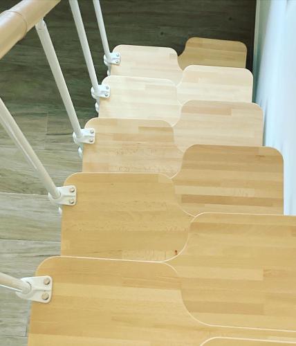 a staircase with wooden treads in a building at Villa Ulyana Sarti - Ancient Greece in Center in Sarti