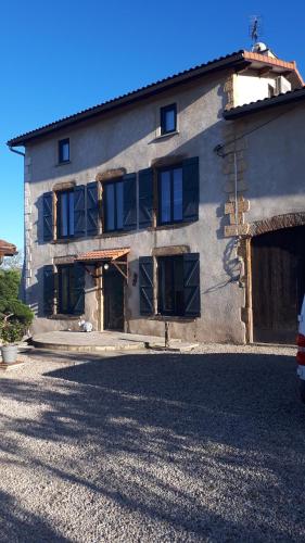 a building with a bunch of windows on it at L'Arche d' Engel in Courpière