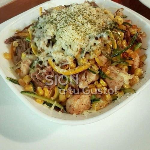 a white bowl of pasta with shrimp and vegetables at Hotel Restaurante Sion in Moniquirá
