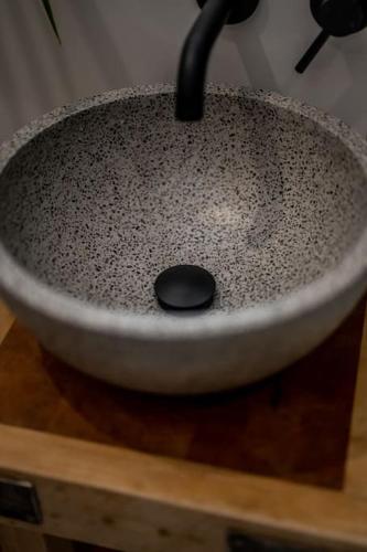 a bowl sitting on top of a wooden table at Spacious & Stylish StoneHous Cottage in Forfar