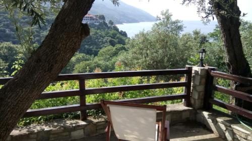 a wooden fence with a view of a lake at Alex Seaview House in Chorefto