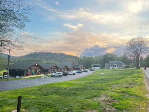 a small town with cars parked on a street at Swiss Chalets Village Inn in North Conway