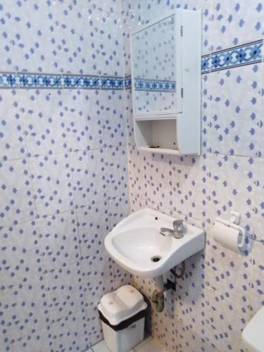 a bathroom with a sink and a toilet at Isla Bonita Beach Resort in San Juan