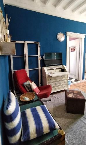 a living room with a bed and a stove at Le Stanze di Matilde in Crevalcore