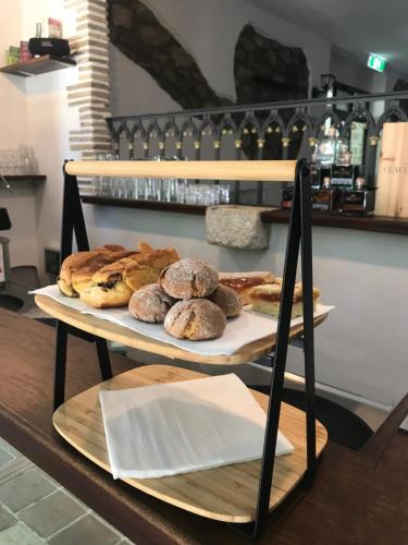 a couple of plates of pastries on a shelf at Hotel Lo Smeraldo in Roccavivara