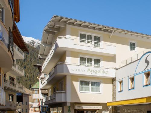a building in the middle of a street at Hotel Garni Angelika in Ischgl