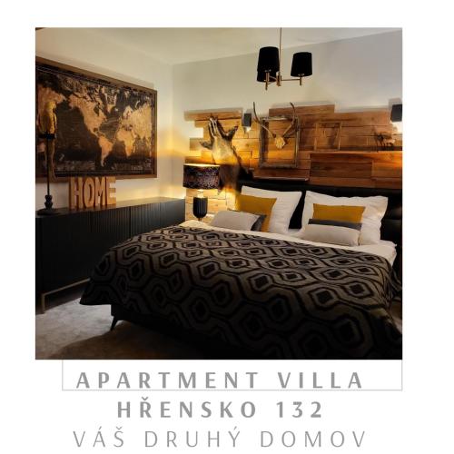 a bedroom with a large bed with a wooden headboard at Apartment Villa Hřensko 132 in Hřensko