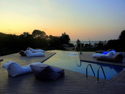 a swimming pool with inflatables on the side of it at Manna Gea in Vonitsa