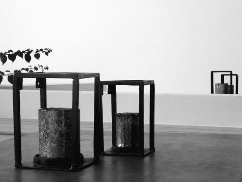 two metal objects sitting on a floor in a room at Manna Gea in Vonitsa