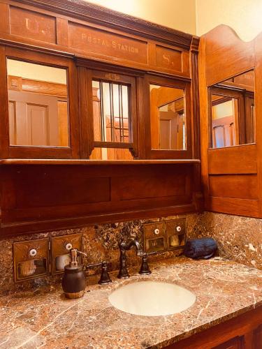 a bathroom with a sink and a mirror at The Bressmer in Springfield