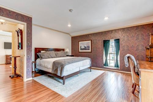 a bedroom with a bed and a desk in it at The Bressmer in Springfield