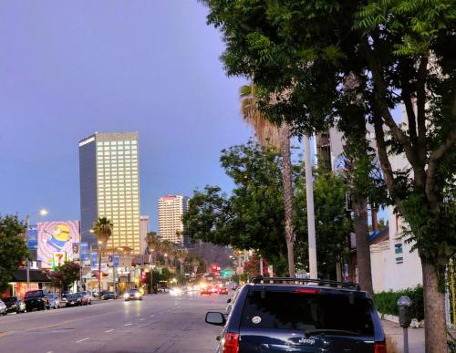 a car parked on the side of a city street at DAY N NIGHT INN - Near Universal Studios Hollywood in Los Angeles