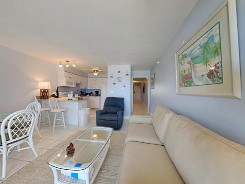 a living room with a couch and a table at Perdido Skye #22 in Perdido Key