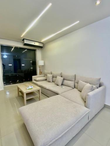 a living room with a couch and a table at Hyat Apartments in Alexandria