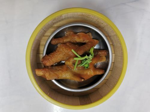 a bowl of food with chicken wings in it at ฺBaan Rai Ing Doi in Chaiyaphum