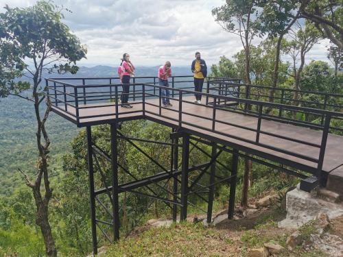 a group of people standing on a viewing platform on a mountain at ฺBaan Rai Ing Doi in Chaiyaphum