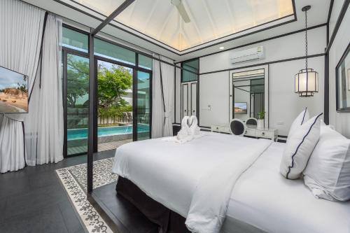 Πισίνα στο ή κοντά στο MONO LUX Villa x MonthStayZ Thailand