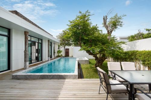 a swimming pool in the backyard of a house at MONO LUX Villa x MonthStayZ Thailand in Chalong 