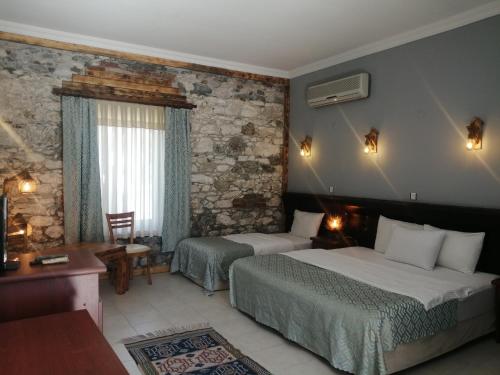 Ένα ή περισσότερα κρεβάτια σε δωμάτιο στο Bacahan Hotel