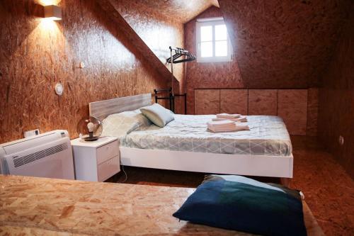 a small bedroom with a bed and a window at Sweet Love Family Double in Coimbra