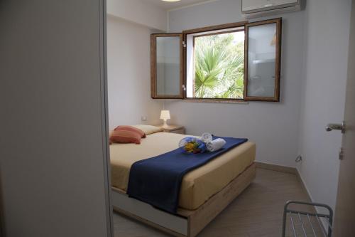 Postel nebo postele na pokoji v ubytování Case Vacanze Baia