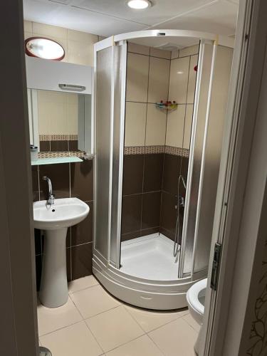 a bathroom with a shower and a sink at Balkan Palace Edirne in Edirne