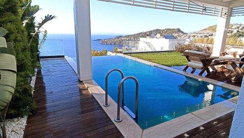 a swimming pool with a view of the ocean at Villa Aleph-Kiralık Müstakil havuzlu lüx villa in Bodrum City
