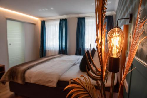 Postel nebo postele na pokoji v ubytování Boutique - Hotel Zum Schloss