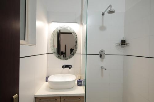 a bathroom with a sink and a mirror at Jai Villa - A Boutique Hotel in Jaipur