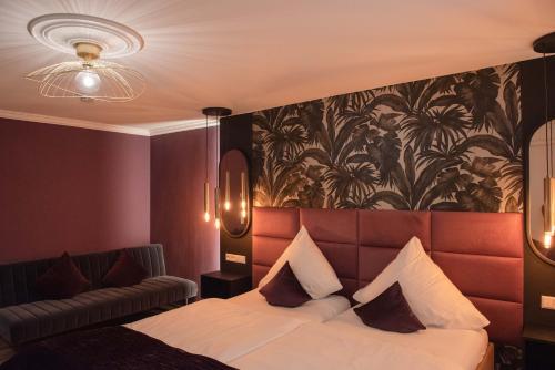 Postel nebo postele na pokoji v ubytování Boutique - Hotel Zum Schloss