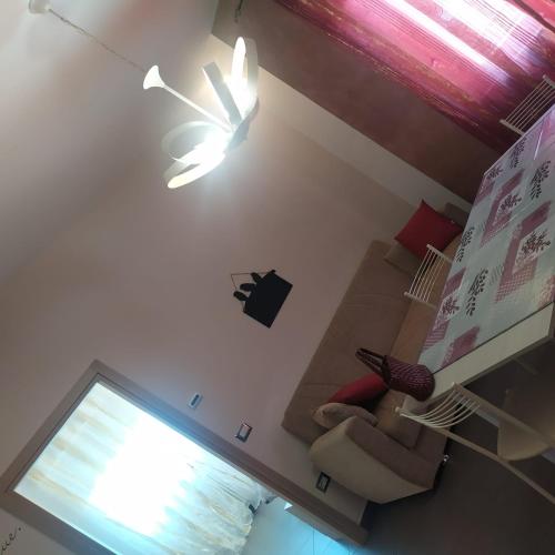 a living room with a couch and a ceiling fan at Terrazza sul Mare in Giulianova