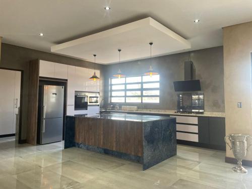 a large kitchen with a large island in the middle at 365@ Vaal De Grace Parys in Parys