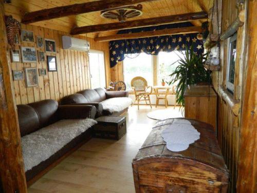 a living room with a couch and a table at Õuna Puhketalu in Jõgeva