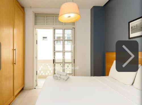 Ένα ή περισσότερα κρεβάτια σε δωμάτιο στο South Beach Vista Mar Apartamentos