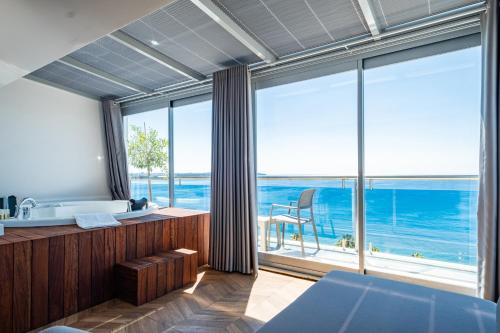 a bathroom with a view of the ocean at PEARLY HOTEL in Antalya