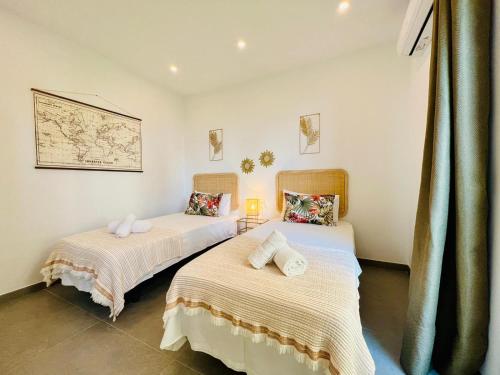 Voodi või voodid majutusasutuse Malagueta beach I & Private Terrace by ELE Apartments toas